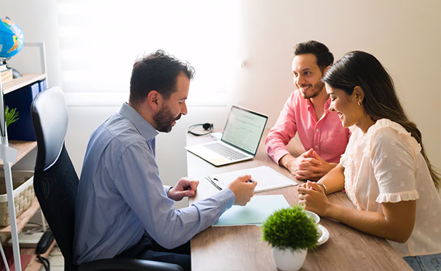 Couple discussing visa process with professional immigration consultants in Kerala